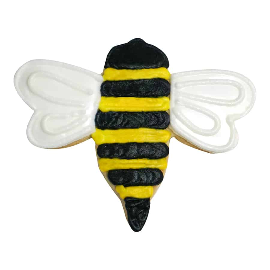 A decorated bumble bee-shaped cookie with black and yellow stripes and white wings, made using a Bumble Bee Cookie Cutter.