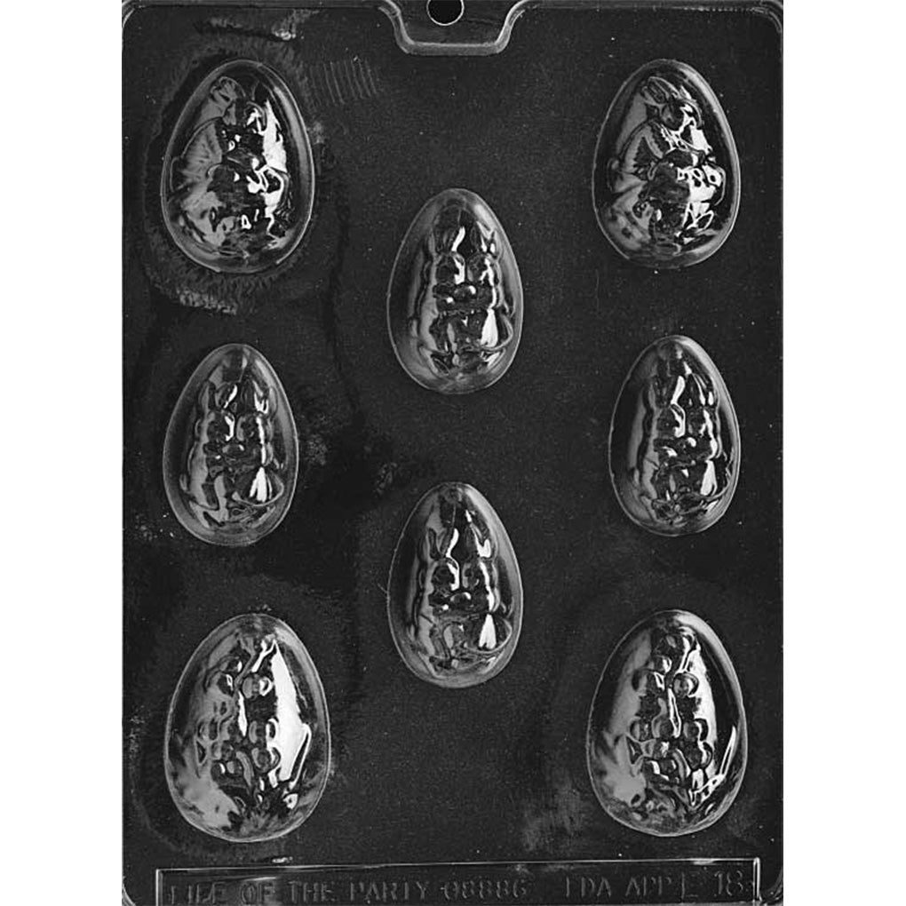 Clear plastic chocolate mold tray with multiple large egg-shaped cavities, each embossed with raised Easter scenes of bunnies and spring foliage, shown on a dark background.