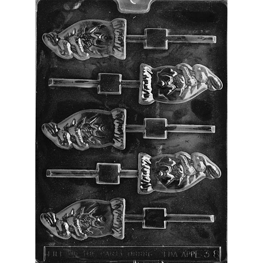 Clear plastic chocolate lollipop mold with bunny peeking out of a cracked egg cavities, showing raised bunny ears and face above a scalloped eggshell line, with built-in stick slots on a dark background.