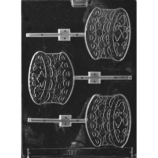 Chocolate lollipop mold with three decorated cake cavities featuring raised flowers, piped frosting swags, and stick channels