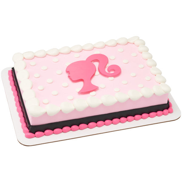 Pink and white polka dot cake decorated with a pink Barbie silhouette lay-on topper.