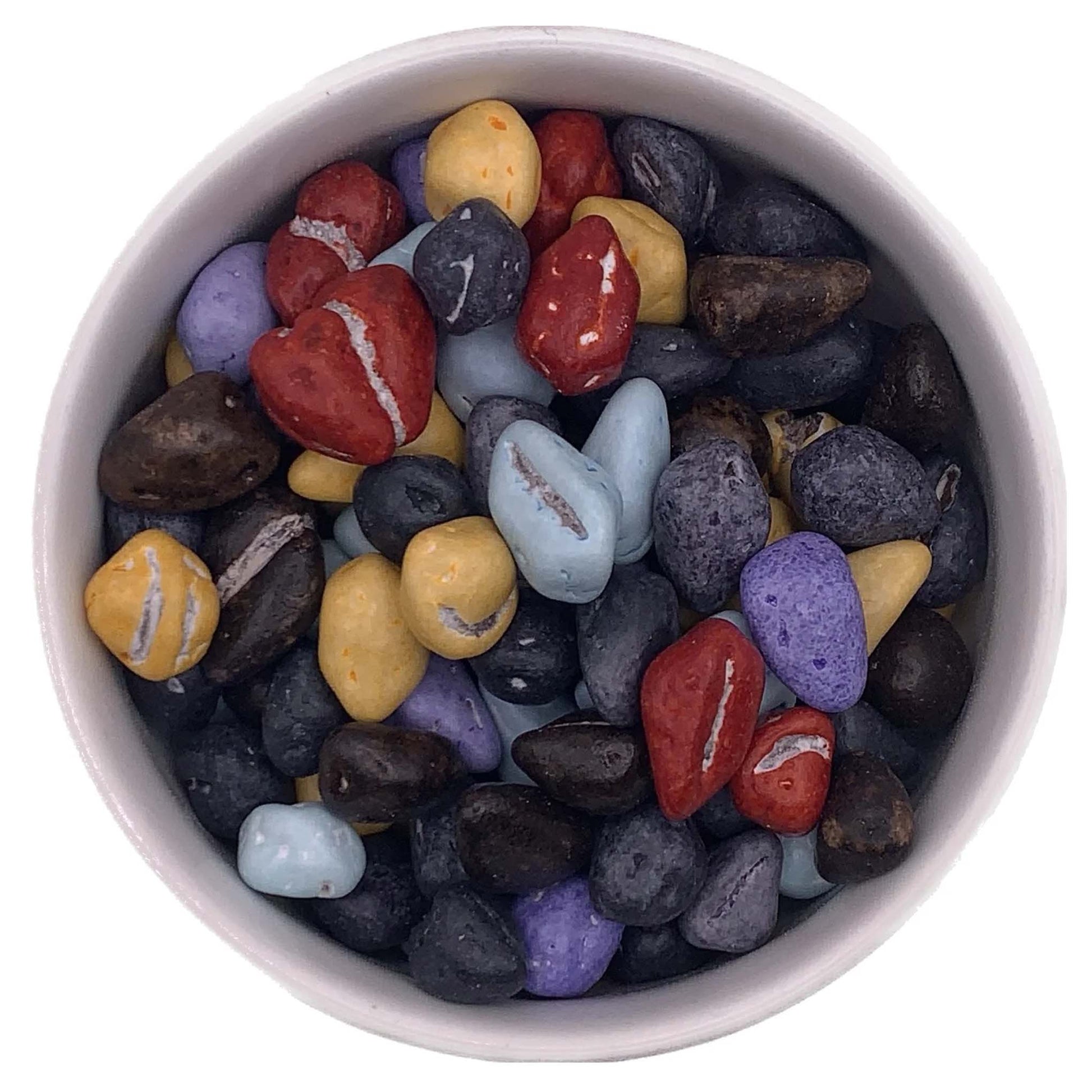 White bowl filled with candy coated milk chocolate rocks in assorted colors including red, yellow, purple, blue, and dark brown, shaped like small pebbles and stones.