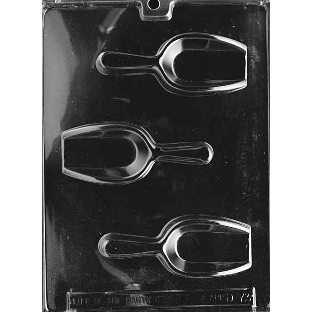 Clear plastic chocolate mold photographed against a black background, featuring three candy scoop-shaped cavities with detailed handles and scoop bowls.
