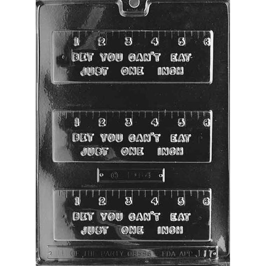 Clear “Bet You Can’t Eat Just One Inch” Ruler Chocolate Mold photographed against a black background with three rectangular ruler cavities featuring raised 1–6 inch markings and lettering.
