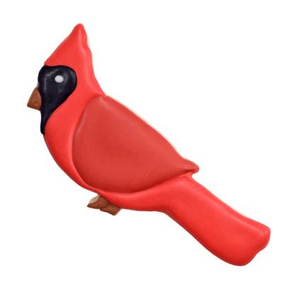 A decorated cardinal cookie with bright red icing, a black face mask, and a brown beak, capturing the bird's classic look.