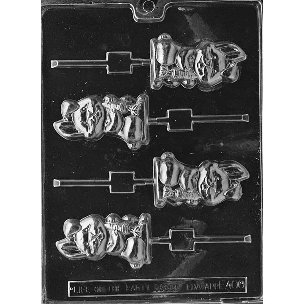Clear plastic chocolate lollipop mold with four cavities showing a cartoon bunny with floppy ears holding a large carrot, each cavity connected to a lollipop stick channel on a dark background.
