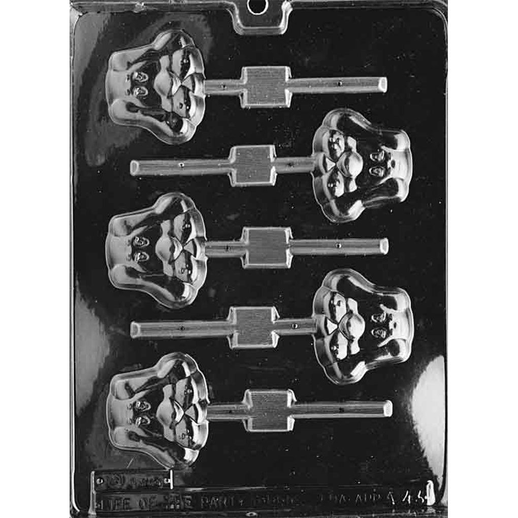 Clear Hound Puppy Chocolate Lollipop Mold photographed against a black background with five cartoon puppy face cavities featuring floppy ears, large muzzles, bows, and stick channels.