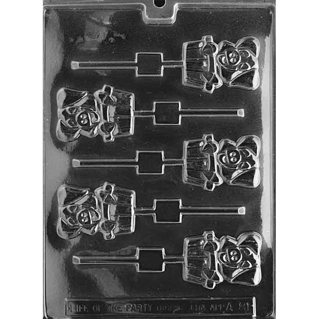 Clear chocolate lollipop mold with five smiling pig characters peeking from ridged washtubs, each connected to a long stick channel on a black background.