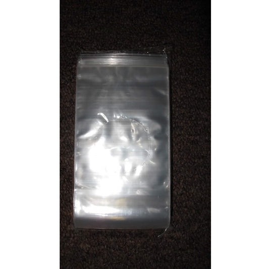 Stack of 100 clear 3 x 5 1/2-inch polypropylene cello-style bags for chocolate suckers