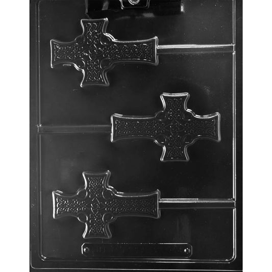 Clear plastic chocolate lollipop mold with three Celtic cross-shaped cavities featuring raised knot-style detail and a circular center, each with a built-in stick channel, shown on a dark background.