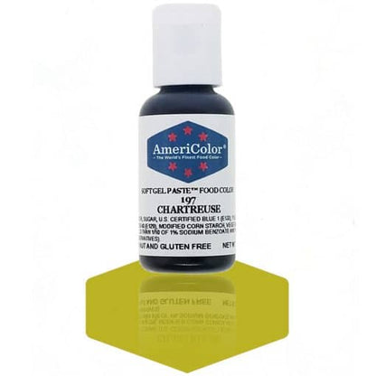 A bottle of AmeriColor Chartreuse soft gel paste food coloring with a white cap and blue label featuring red stars, standing on a vibrant chartreuse yellow-green reflective surface that mirrors the bottle.