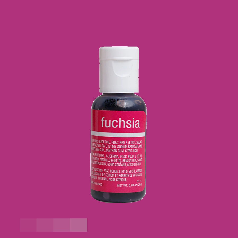 A chefmaster food coloring bottle with a vibrant pink liquid visible through the clear glass, the label reads "fuchsia" in lowercase white letters against a deep pink banner. The cap is white, and the label details ingredients in small white text.
