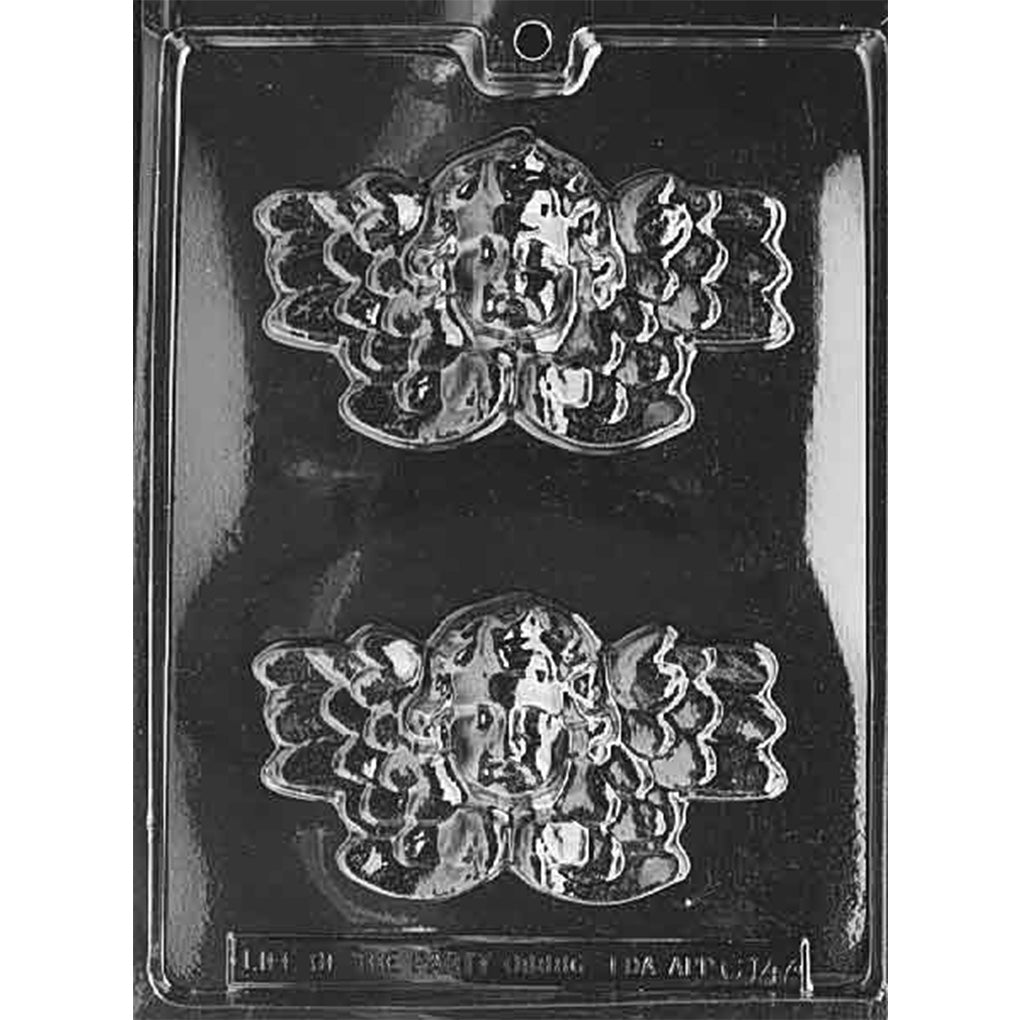 Clear plastic chocolate mold with two cherub angel face cavities, each showing a childlike face framed by large textured wings and curly hair, on a dark background.