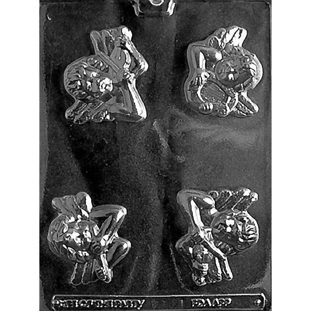 Clear plastic chocolate mold photographed on a black background with four cherub-shaped cavities, each showing a winged cherub holding a musical instrument like a harp, flute, or violin.