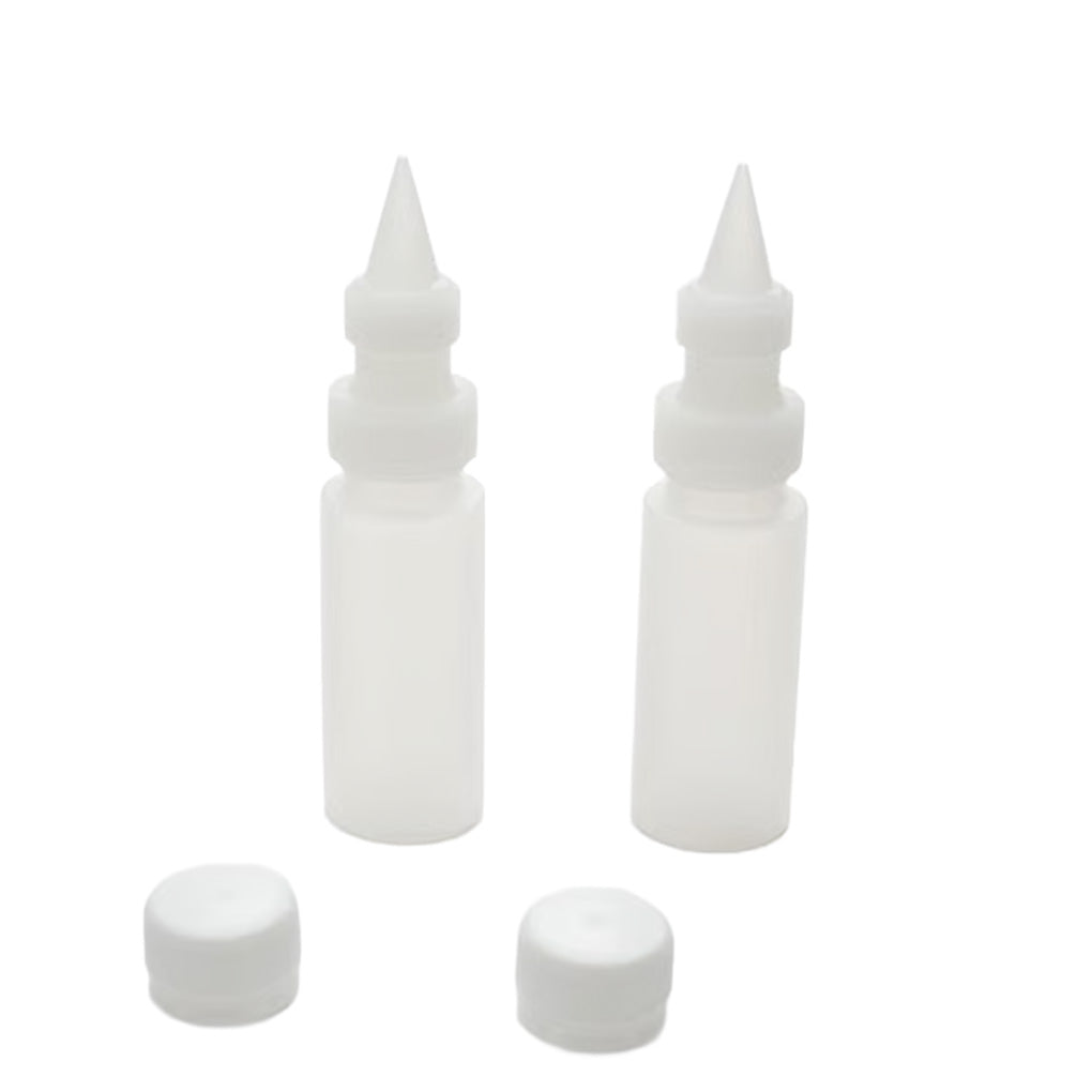 Two translucent 2 oz chocolate squeeze bottles with narrow plastic decorating tips, couplers, and removable caps