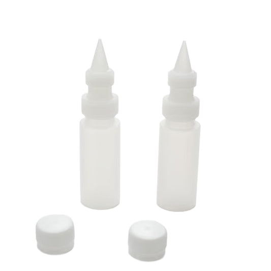 Two translucent 2 oz chocolate squeeze bottles with narrow plastic decorating tips, couplers, and removable caps