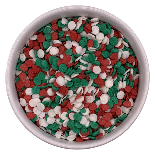 Bowl of red, green, and white edible sequin sprinkles for Christmas-themed dessert decorating, sold in a 4 oz container.