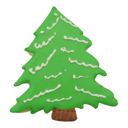 Decorated Christmas tree cookie with green icing, white snow accents, and a brown trunk.