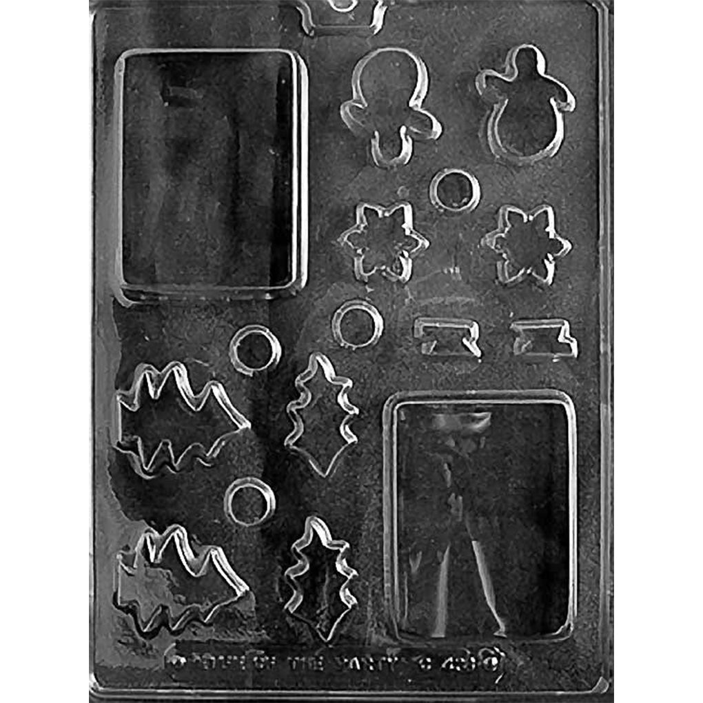 Christmas chocolate bar mold with two large rectangular bar cavities and assorted holiday shapes including gingerbread figure, snowman, snowflakes, holly, circles, and banner accents