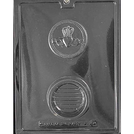 Claddagh pour box chocolate mold with two large round cavities in clear plastic, one embossed with a Claddagh symbol featuring a heart, hands, and crown, and one smooth round base cavity.