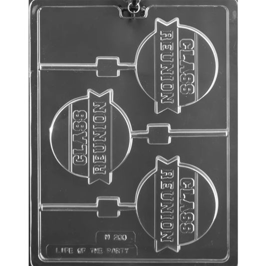 Clear plastic chocolate lollipop mold with three round cavities embossed with “Class Reunion” on a ribbon banner, each with a stick channel, shown on a dark background.