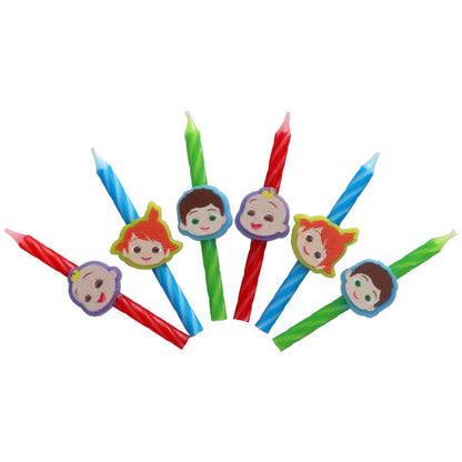 CoComelon birthday candles featuring JJ, Nico, and TomTom character toppers on red, blue, and green spiral candles, displayed in a scattered fan shape.