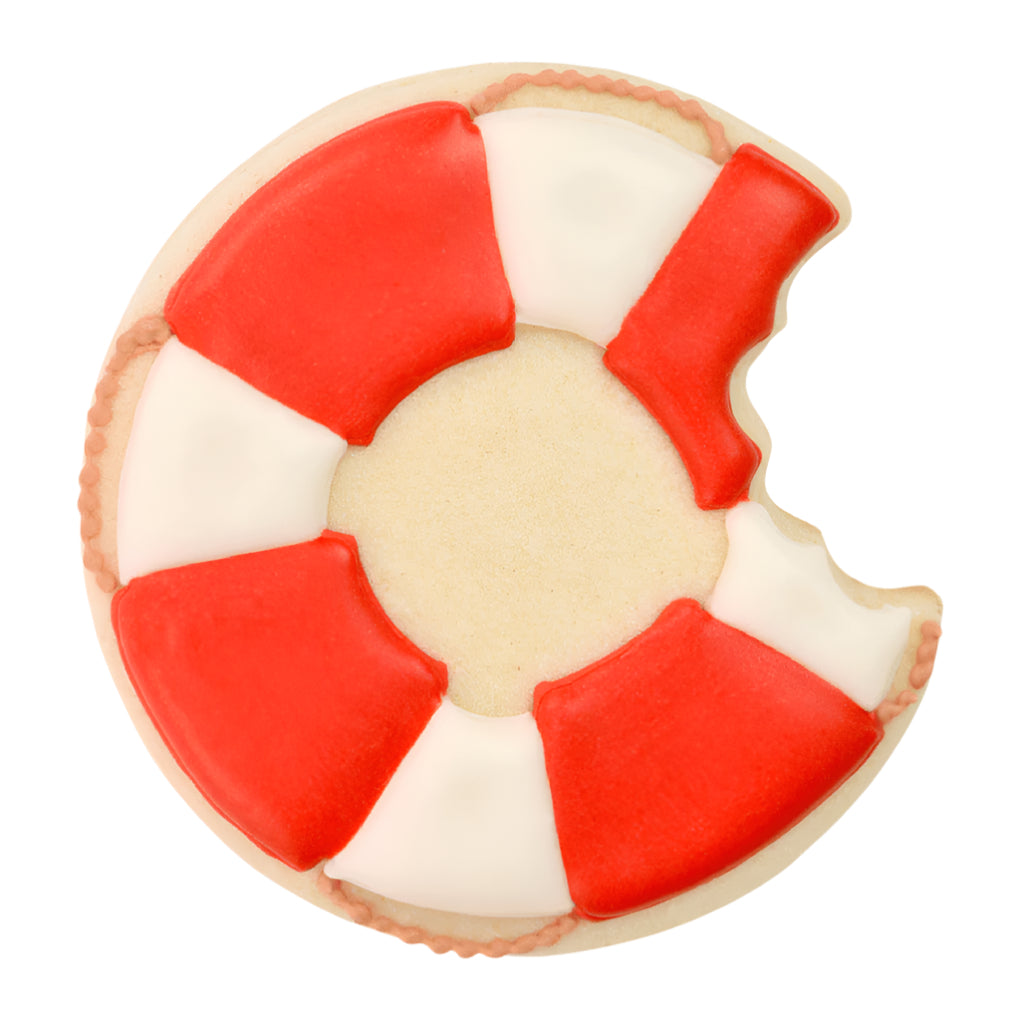 Decorated lifebuoy cookie with red and white icing, shaped like it has a bite taken out of it.