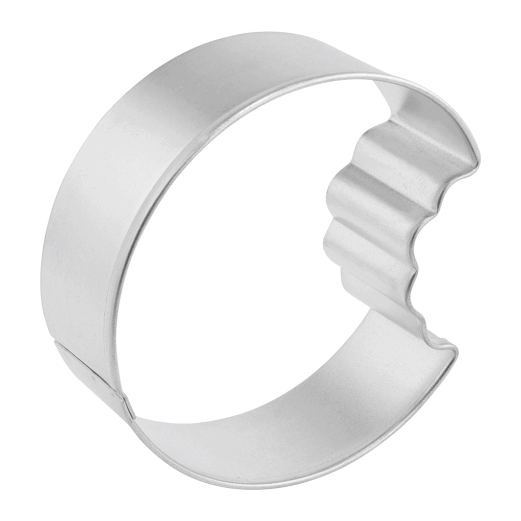 Side view of the cookie bite cutter, showing its smooth round edge and scalloped "bite" detail.