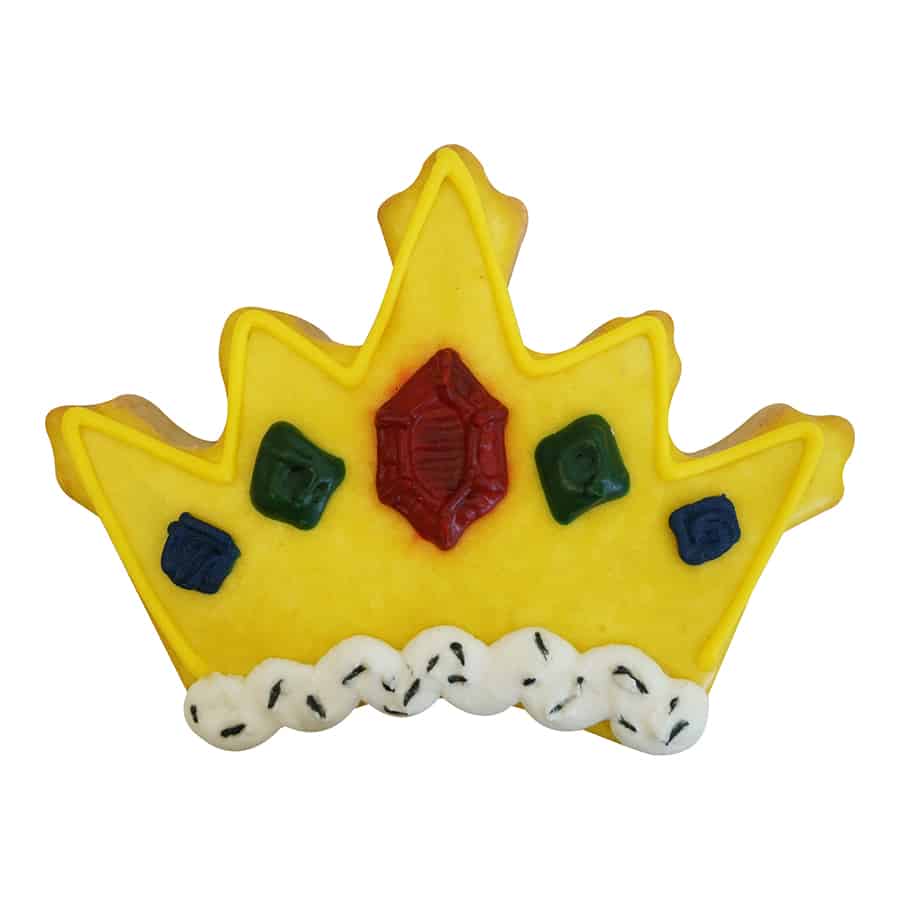 Decorated crown-shaped cookie with yellow icing and jewel-like details.