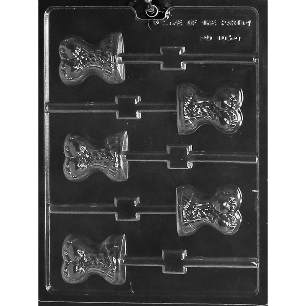 Clear plastic corset chocolate lollipop mold with six corset-shaped cavities and stick channels, photographed on a dark background.