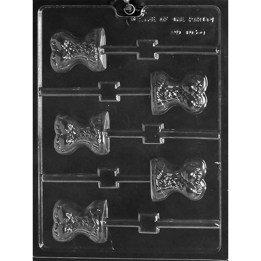 Clear plastic corset chocolate lollipop mold with six corset-shaped cavities and stick channels, photographed on a dark background.