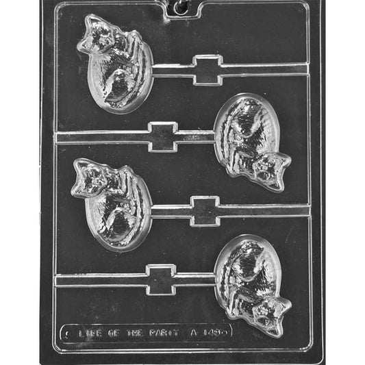 Clear plastic chocolate lollipop mold with four curled-up cat cavities, each showing a cozy cat with pointed ears and facial detail, with stick channels extending from the shapes.