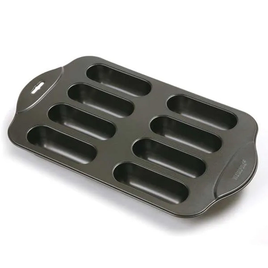8-cavity Cream Canoe nonstick baking pan with long rounded cavities for making homemade cream-filled snack cakes.