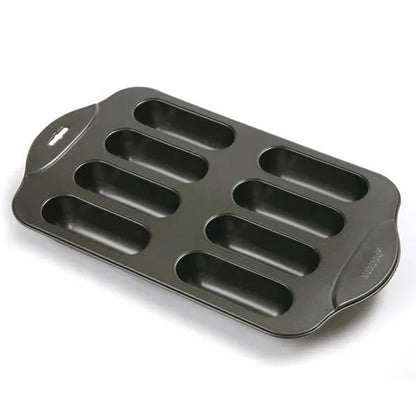 8-cavity Cream Canoe nonstick baking pan with long rounded cavities for making homemade cream-filled snack cakes.