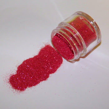Bold crimson red Galaxy Glitter Dust flowing from a clear container, sparkling with tiny flecks of pink and crimson.