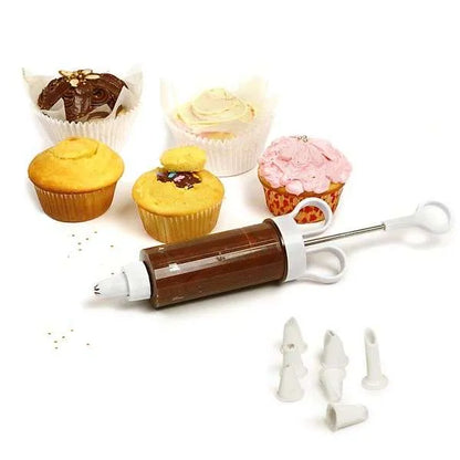 Cupcake injector with chocolate filling next to decorated cupcakes and tips.
