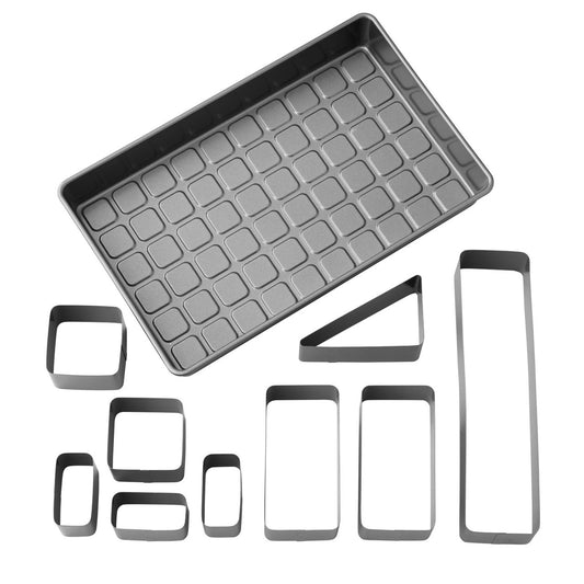 Empty nonstick letter and number cake pan set shown with 8 adjustable metal inserts laid out separately.