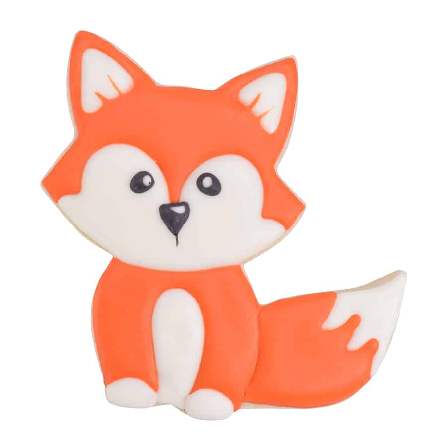 Decorated fox cookie with orange and white icing, featuring a sweet expression and fluffy tail.