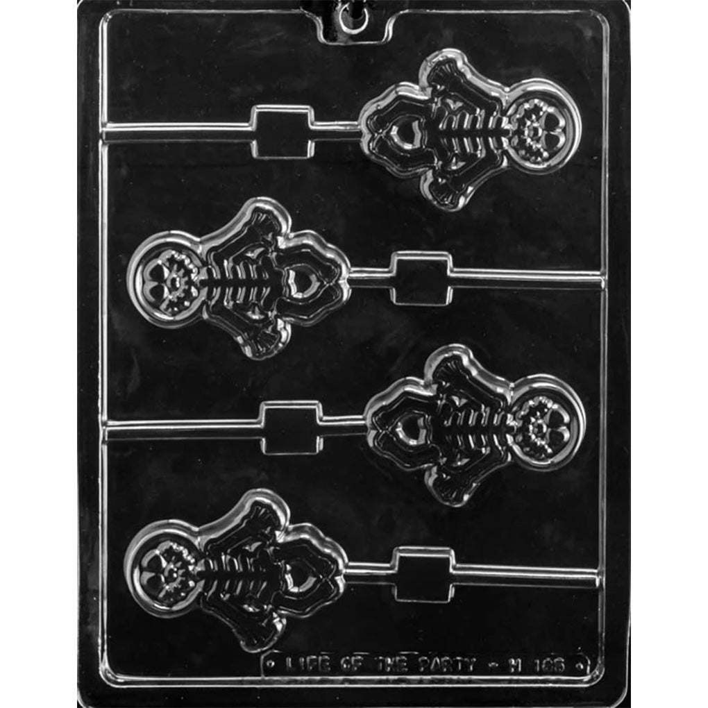 Clear plastic chocolate lollipop mold with four cavities shaped like a cute cartoon skeleton, each with a built-in stick channel, shown on a dark background.