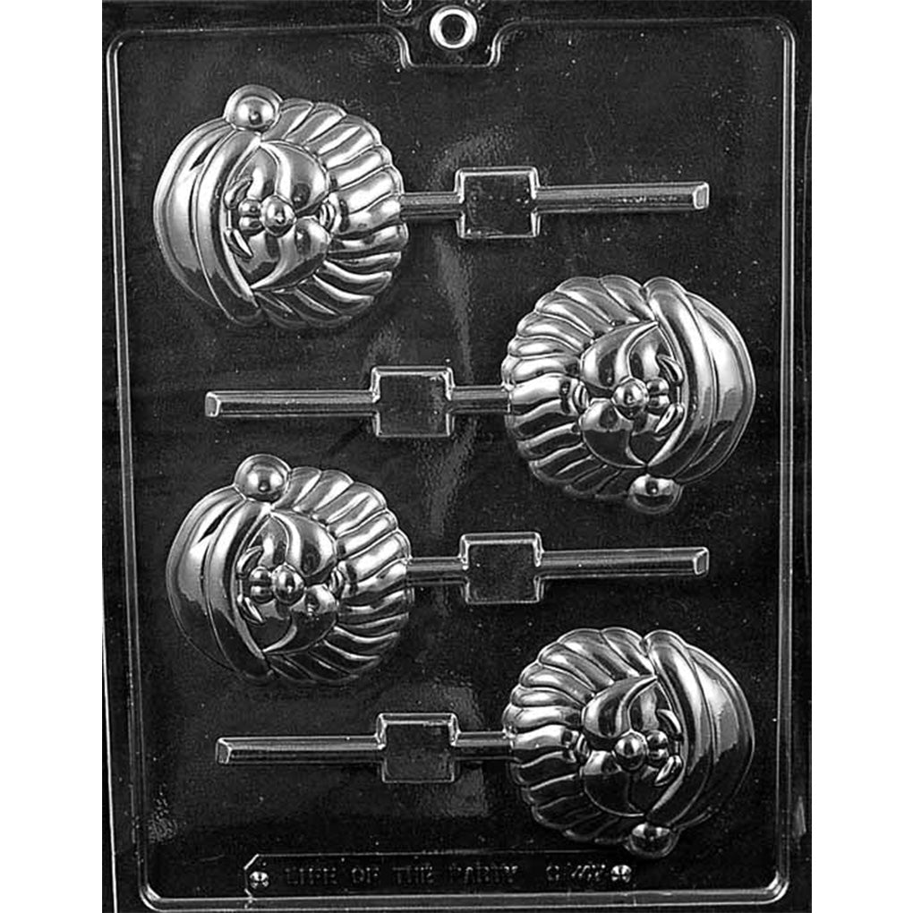 Clear plastic chocolate lollipop mold with four cute Santa face cavities and stick channels, photographed on a dark background