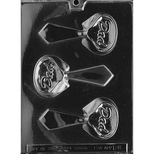 Clear plastic chocolate mold with three shirt collar and necktie cavities, each tie embossed with the word “DAD,” shown on a dark background.