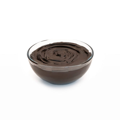Smooth dark chocolate ganache in a bowl with a glossy, rich chocolate texture ready for spreading, piping, filling, or melting.