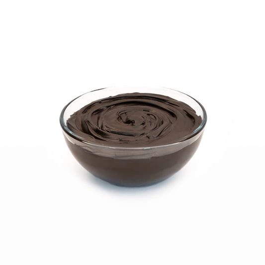 Smooth dark chocolate ganache in a bowl with a glossy, rich chocolate texture ready for spreading, piping, filling, or melting.