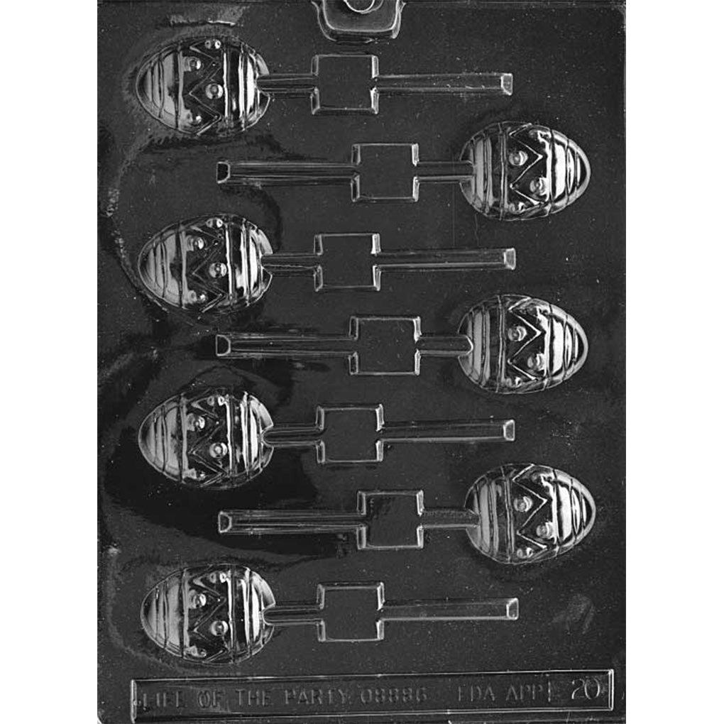 Clear plastic chocolate lollipop mold with multiple Easter egg-shaped cavities, each with raised horizontal stripes and a zigzag band with dot details, plus built-in stick slots.