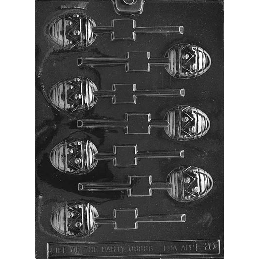 Clear plastic chocolate lollipop mold with multiple Easter egg-shaped cavities, each with raised horizontal stripes and a zigzag band with dot details, plus built-in stick slots.
