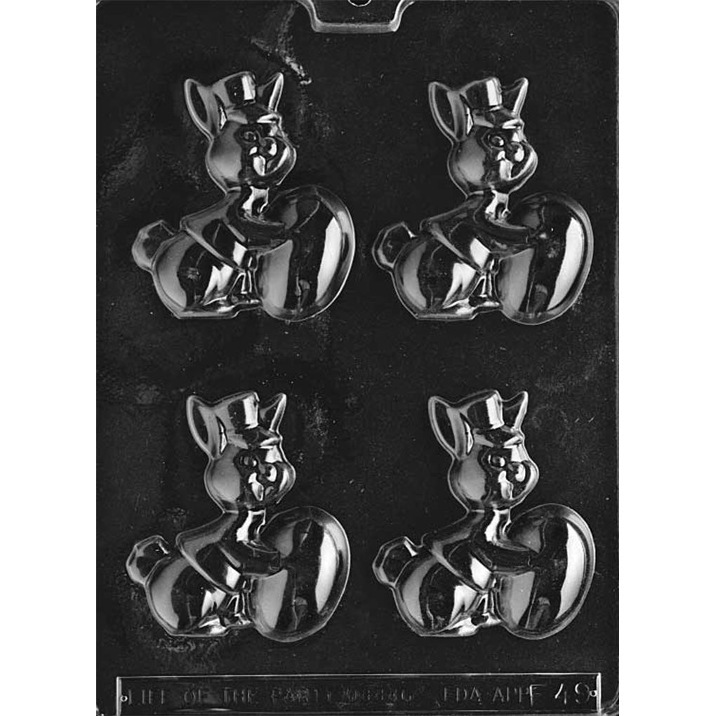 Clear plastic chocolate mold with four cavities showing a delivery-themed bunny wearing a cap and vest beside a large egg, photographed on a dark background.