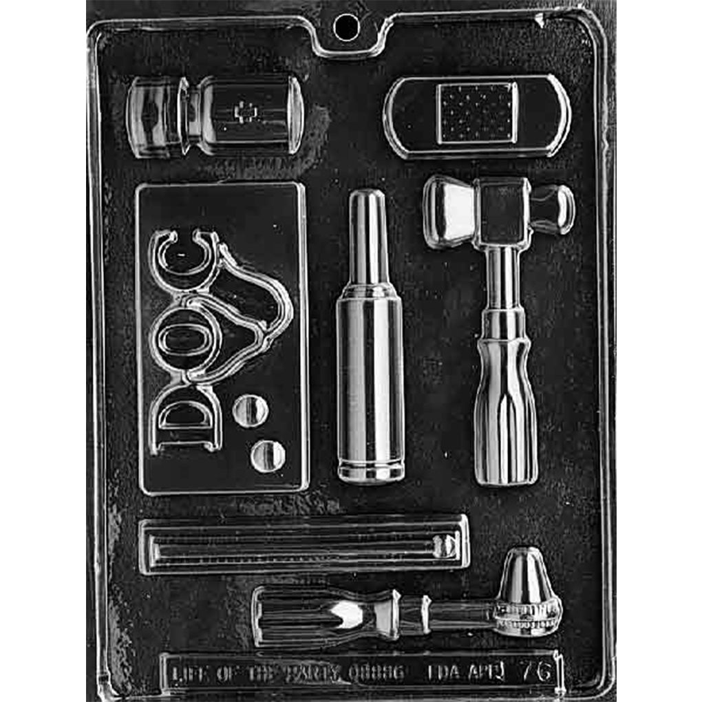 Seven-cavity doctor-themed chocolate mold with a medicine bottle, bandage, doctor’s pad with stethoscope and pills, reflex hammer, thermometer, and two handheld medical instruments.