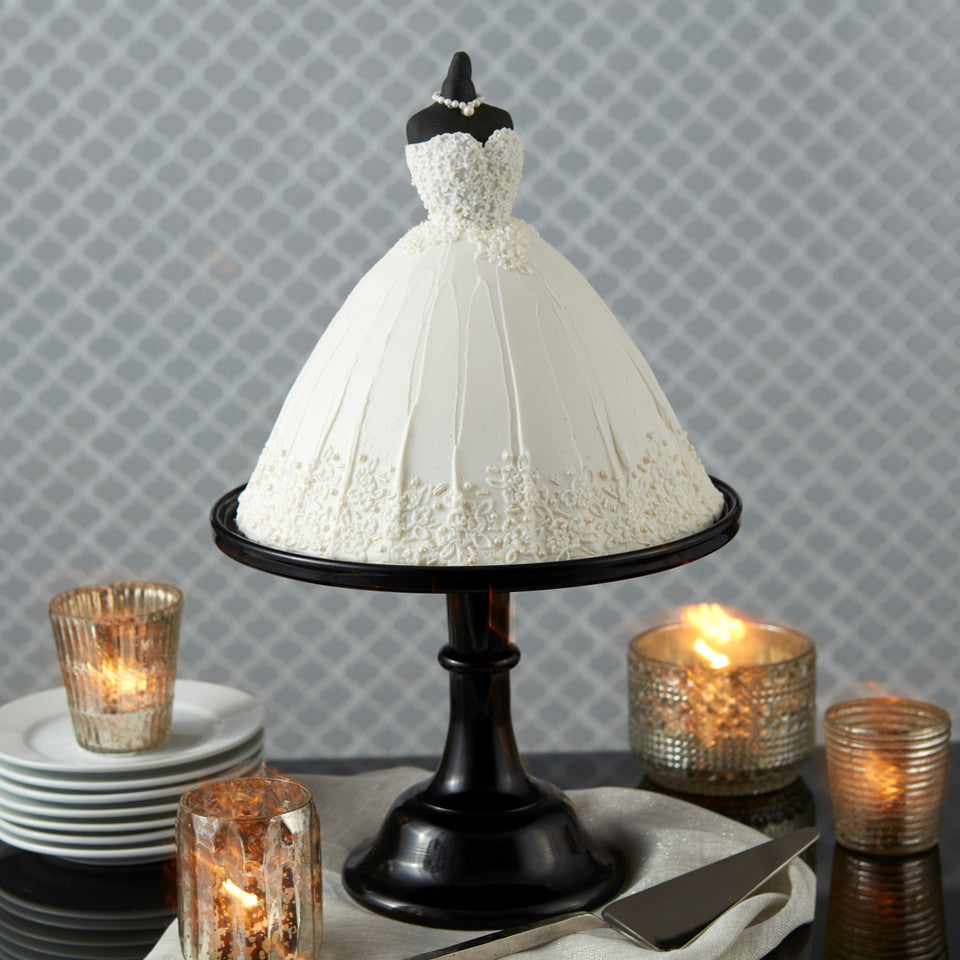 Elegant white wedding dress cake on stand made with Wilton dome cake pan.