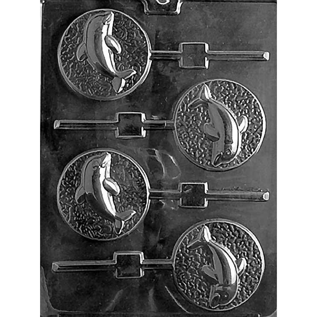Clear plastic chocolate lollipop mold with four round cavities, each featuring a raised leaping dolphin over a textured background, with stick channels extending from the circles.