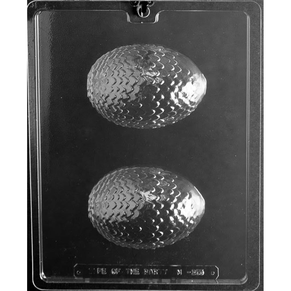 Clear chocolate mold with two large rounded dragon egg half cavities covered in overlapping scale patterns.